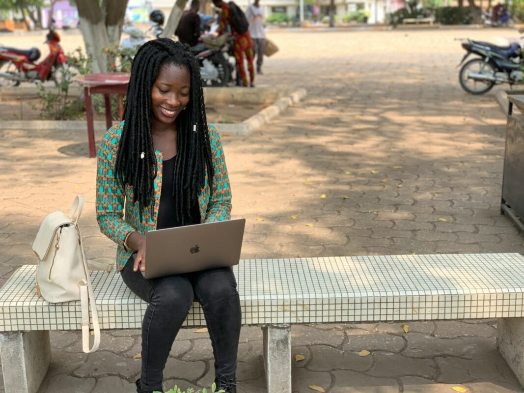 Nigerian university student using a laptop.